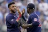 Minnesota Twins' Nelson Cruz, left, and Miguel Sano celebrate after their baseball game against the Kansas City Royals Saturday, June 5, 2021, in Kansas City, Mo. The Twins won 5-4. (AP Photo/Charlie Riedel)