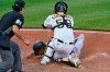 Miami Marlins' Magneuris Sierra, bottom, scores under a tag by Pittsburgh Pirates catcher Jacob Stallings (58) during the ninth inning of a baseball game in Pittsburgh, Saturday, June 5, 2021. Sierra scored on a single by Jesus Aguilar. Umpire James Hoye, left, makes the call. (AP Photo/Gene J. Puskar)