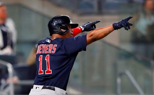 Boston Red Sox's Rafael Devers celebrates after scoring against the New York Yankees during the eighth inning of a baseball game Saturday, June 5, 2021, in New York. (AP Photo/Noah K. Murray)