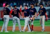 Boston Red Sox center fielder Alex Verdugo, center, celebrates with teammates after the Red Sox defeated the New York Yankees 7-3 in a baseball game Saturday, June 5, 2021, in New York. (AP Photo/Noah K. Murray)