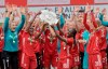 The players and team members from FC Bayern Munich women soccer team celebrate after winning the German women Bundesliga championship in Munich, Germany, Sunday, June 6, 2021. (Peter Kneffel/dpa via AP)