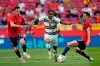Portugal's Renato Sanches, centre, tries to get past Spain's Pablo Sarabia, left and Sergio Busquets during the international friendly soccer match between Spain and Portugal at the Wanda Metropolitano stadium in Madrid, Spain on Friday June 4, 2021. (AP Photo/Manu Fernandez)