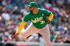 Oakland Athletics relief pitcher Yusmeiro Petit works against the Colorado Rockies in the eighth inning of a baseball game Sunday, June 6, 2021, in Denver. (AP Photo/David Zalubowski)
