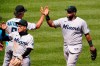 Miami Marlins first baseman Jesus Aguilar, right, is greeted by manager Don Mattingly as he walks off the field following a baseball game against the Pittsburgh Pirates in Pittsburgh, Sunday, June 6, 2021. The Marlins won 3-1. (AP Photo/Gene J. Puskar)