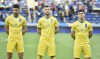 Ukraine's Roman Yaremchuk, left, Andriy Yarmolenko, center, and Ruslan Malinovskyi stand in a new kit for Ukraine's soccer team that shows a map including Russian-annexed Crimea before the international friendly soccer match between Ukraine and Cyprus in Kharkiv, Ukraine, Monday, June 7, 2021. Russian officials and lawmakers have denounced the design of the Ukrainian national soccer team's shirt for this month's European Championship. The yellow-and-blue Ukrainian uniform features a map of the country that includes Crimea and the slogan 