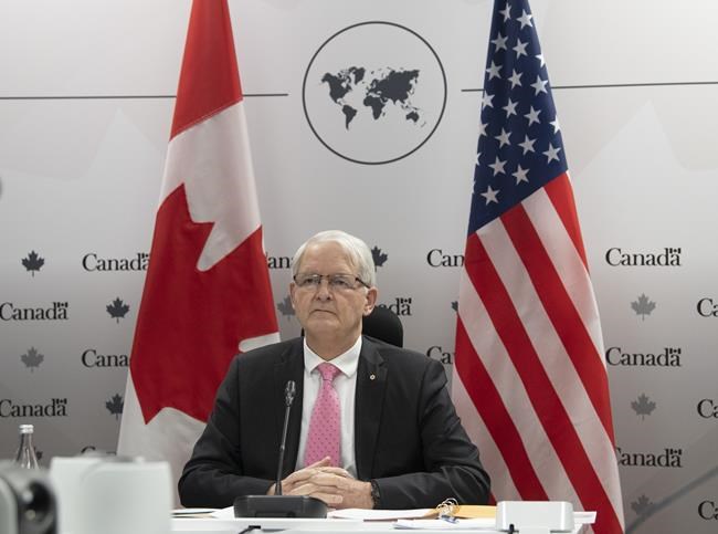 Foreign Affairs Minister Marc Garneau waits for a virtual meeting to begin with US Secretary of State Antony Blinken in Ottawa, Friday, Feb. 26, 2021. Garneau says China's growing authoritarianism and coercive diplomacy constitute a challenge to democratic countries around the world including Canada. THE CANADIAN PRESS/Adrian Wyld