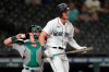 Seattle Mariners' Jarred Kelenic reacts after striking out swinging, while Oakland Athletics catcher Sean Murphy returns the ball during the eighth inning of a baseball game Tuesday, June 1, 2021, in Seattle. (AP Photo/Ted S. Warren)