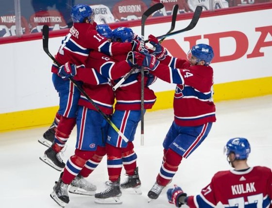 Montreal Canadiens' Tyler Toffoli celebrates with teammates after scoring the winning goal following overtime NHL Stanley Cup playoff hockey action against the Winnipeg Jets, in Montreal, Monday, June 7, 2021. THE CANADIAN PRESS/Paul Chiasson