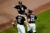 Chicago White Sox's Leury Garcia (28) and Adam Engel (15) celebrate with Andrew Vaughn after Vaughn's home run off Toronto Blue Jays starting pitcher Robbie Ray during the seventh inning of a baseball game Tuesday, June 8, 2021, in Chicago. (AP Photo/Charles Rex Arbogast)