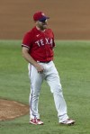 Texas Rangers relief pitcher Ian Kennedy walks off the mound after striking out the final Tampa Bay Rays batter in a baseball game in Arlington, Texas, Friday, June 4, 2021. (AP Photo/Andy Jacobsohn)