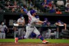 New York Mets designated hitter Pete Alonso watches his ball while hitting a solo home run off Baltimore Orioles relief pitcher Travis Lakins Sr., during the ninth inning of a baseball game, Tuesday, June 8, 2021, in Baltimore. The Orioles won 10-3. (AP Photo/Julio Cortez)
