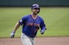 New York Mets' Pete Alonso runs the bases after hitting a two-run home run off Baltimore Orioles starting pitcher Matt Harvey during the first inning of a baseball game, Wednesday, June 9, 2021, in Baltimore. Mets' Francisco Lindor scored on the home run. (AP Photo/Julio Cortez)