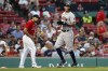 Houston Astros' Carlos Correa, right, scores on a double by Yordan Alvarez during the third inning of a baseball game, Wednesday, June 9, 2021, in Boston. (AP Photo/Michael Dwyer)