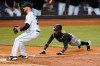 Colorado Rockies' Raimel Tapia, right, dives into home as Miami Marlins relief pitcher John Curtiss, left, waits for the throw on a passed ball by catcher Sandy Leon (not shown) during the fifth inning of a baseball game, Wednesday, June 9, 2021, in Miami. (AP Photo/Wilfredo Lee)