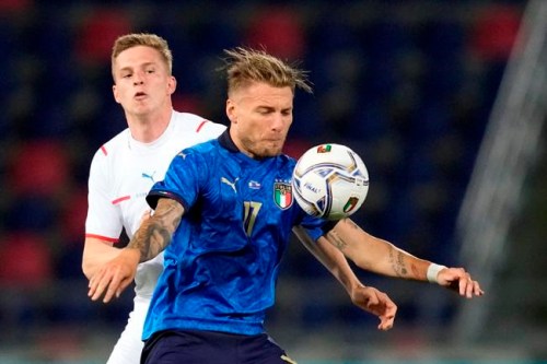 Italy's Ciro Immobile, right, is challenged by Czech Republic's David Zima during the international friendly soccer match between Italy and Czech Republic in Bologna, Italy, Friday, June 4, 2021. (AP Photo/Antonio Calanni)