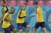 Ukraine's Oleksandr Zinchenko, center, warms up along with team mates during a training session in Voluntari, on the outskirts of Bucharest, Romania, Wednesday, June 9, 2021 two days before the start of Euro 2020 soccer championship. Russian officials have objected to the Ukrainian national soccer team's shirt for including Russian Crimea in the design for this month's European Championship. (AP Photo/Vadim Ghirda)