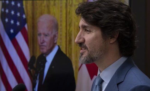 United States President Joe Biden listens via video as Canadian Prime Minister Justin Trudeau speaksduring a press conference in Ottawa, Tuesday, Feb. 23, 2021. A New York congressman says Prime Minister Justin Trudeau and President Joe Biden will discuss plans to reopen the Canada-U.S. border when they meet on the margins of the G7 summit. THE CANADIAN PRESS/Adrian Wyld