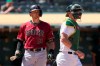 Oakland Athletics catcher Sean Murphy, right, walks toward the mound as Arizona Diamondbacks' Nick Ahmed (13) reacts to striking out for the final out in the Athletics' 4-0 win in a baseball game Wednesday, June 9, 2021, in Oakland, Calif. (AP Photo/Tony Avelar)