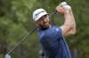 CORRECTS FARAWAY TO FAIRWAY Dustin Johnson watches his drive down the ninth fairway during the first round of the Palmetto Championship golf tournament in Ridgeland, S.C., Thursday, June 10, 2021. (AP Photo/Stephen B. Morton)
