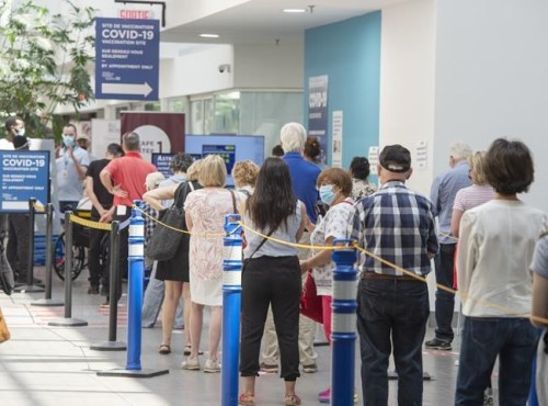 People line up to get their COVID-19 vaccine at a vaccination centre, Thursday, June 10, 2021 in Montreal. THE CANADIAN PRESS/Ryan Remiorz