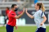 U.S. coach Vlatko Andonovski, left, greets Samantha Mewis as she joins teammates for warmups before an international friendly soccer match against Portugal on Thursday, June 10, 2021, in Houston. (AP Photo/David J. Phillip)