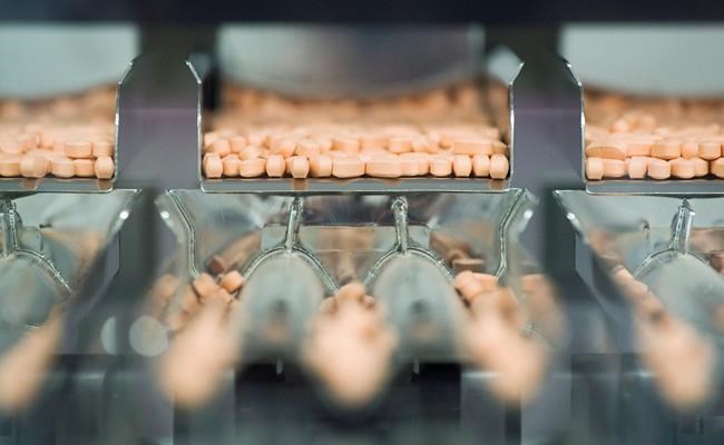 Multivitamins are shown on the packaging line at the Pfizer plant in Montreal, Thursday, July 12, 2012. THE CANADIAN PRESS/Graham Hughes