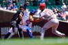 St. Louis Cardinals' Matt Carpenter (13) shows second base umpire Mike Muchlinski the ball after catching Chicago Cubs' Joc Pederson trying to steal second during the first inning of a baseball game Friday, June 11, 2021, in Chicago. (AP Photo/Charles Rex Arbogast)