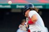 Cleveland Indians' Austin Hedges is hit by a pitch during the third inning of the team's baseball game against the Seattle Mariners, Friday, June 11, 2021, in Cleveland. (AP Photo/Tony Dejak)