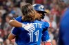 Toronto Blue Jays' Vladimir Guerrero Jr. celebrates his two-run home run with Bo Bichette (11) during the sixth inning of the team's baseball game against the Boston Red Sox at Fenway Park, Friday, June 11, 2021, in Boston. (AP Photo/Elise Amendola)