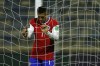 Chile's Alexis Sanchez holds the net during a qualifying soccer match against Bolivia for the FIFA World Cup Qatar 2022 in Santiago, Chile, Wednesday, June 9, 2021. (Marcelo Hernandez, Pool via AP)