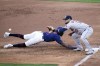 Minnesota Twins' NickGordon, left, beats the throw to Houston Astros first baseman Yuli Gurriel on a pickoff-attempt in the third inning of a baseball game, Saturday, June 12, 2021, in Minneapolis. (AP Photo/Jim Mone)