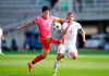 South Korea's Son Heung-min, left, fights for the ball against Lebanon's Kassem El Zein during their Asian zone Group H qualifying soccer match for the FIFA World Cup Qatar 2022 at Goyang stadium in Goyang, South Korea, Sunday, June 13, 2021. (AP Photo/Lee Jin-man)