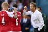 Denmark's managaer Kasper Hjulmand talks to the players during the Euro 2020 soccer championship group B match between Denmark and Finland at Parken Stadium in Copenhagen, Saturday, June 12, 2021. (Stuart Franklin/Pool via AP)