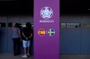 People look from a window a vaccination center inside the La Cartuja stadium in Seville, Spain, Saturday, June 12, 2021. The stadium will host the games of Group E and one of the round of 16 for the Euro 2020 soccer. (AP Photo/Thanassis Stavrakis)