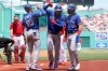 Toronto Blue Jays right fielder Teoscar Hernandez, center right, celebrates with Marcus Semien (10) and Bo Bichette, right, after Hernandez hit a three-run home run in the first inning of a baseball game, as Boston Red Sox's Kevin Plawecki, left, looks on, Sunday, June 13, 2021, in Boston. (AP Photo/Steven Senne)