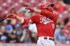 Cincinnati Reds' Joey Votto hits an RBI-single during the second inning of a baseball game against the Colorado Rockies in Cincinnati, Sunday, June 13, 2021. (AP Photo/Aaron Doster)