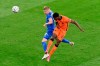 Netherlands' Denzel Dumfries scores his side's third goal during the Euro 2020 soccer championship group C match between Netherlands and Ukraine at Johan Cruijff Arena in Amsterdam, Netherlands, Sunday, June 13, 2021. (AP Photo/Olaf Kraak, Pool)