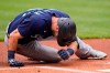 Seattle Mariners' Mitch Haniger lays on the field after getting hit by a pitch in the first inning of a baseball game against the Cleveland Indians, Sunday, June 13, 2021, in Cleveland. Haniger left the game after the incident. (AP Photo/Tony Dejak)