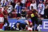 Denmark's Christian Eriksen lays on the ground after collapsing during the Euro 2020 soccer championship group B match between Denmark and Finland at Parken stadium in Copenhagen, Denmark, Saturday, June 12, 2021. (Friedemann Vogel/Pool via AP)