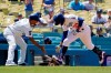 Los Angeles Dodgers' Mookie Betts, right, is congratulated by third base coach Dino Ebel as he rounds third after hitting a solo home run during the third inning of a baseball game against the Texas Rangers Sunday, June 13, 2021, in Los Angeles. (AP Photo/Mark J. Terrill)