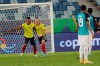 Colombia's Rafael Borre, left, and Colombia's Miguel Borja celebrate the opening goal scored by Colombia's Edwin Cardona during a Copa America soccer match against Ecuador at Arena Pantanal stadium in Cuiaba, Brazil, Sunday, June 13, 2021. (AP Photo/Andre Penner)