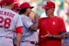 St. Louis Cardinals pitching coach Mike Maddux, right, talks to starting pitcher Carlos Martinez during the third inning of a baseball game against the Chicago Cubs in Chicago, Sunday, June 13, 2021. (AP Photo/Nam Y. Huh)