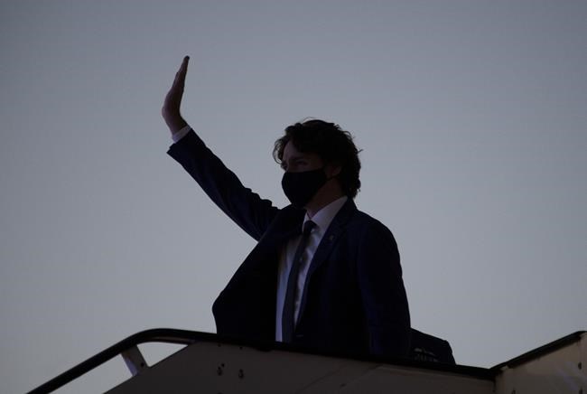 Canadian Prime Minister Justin Trudeau waves as he arrives in Brussels, Belgium, Sunday, June 13, 2021. The Prime Minister is in Brussels today for a meeting of the North Atlantic Treaty Organization and then a Canada-EU summit. THE CANADIAN PRESS/Adrian Wyld