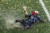 France's Benjamin Mendy celebrates with the trophy after his team won the final match against Croatia at the 2018 soccer World Cup in the Luzhniki Stadium in Moscow, Russia, on July 15, 2018. France and Germany usually tussle in the latter stages of major tournaments. The heavyweights meet in the group stage of a European Championship or World Cup for the first time on Tuesday when they finally open their Euro 2020 campaigns. (AP Photo/Rebecca Blackwell)