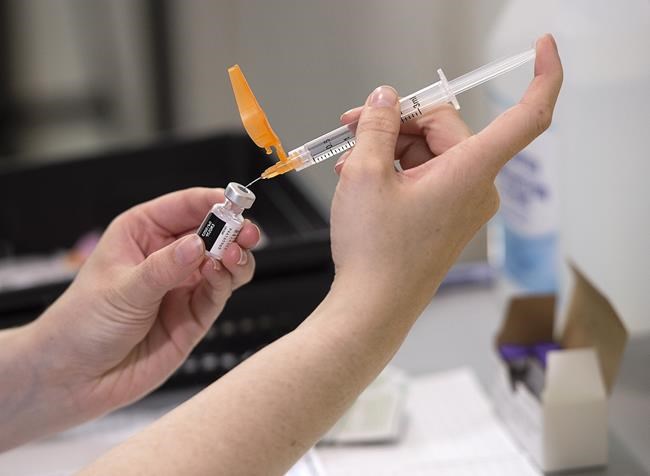 The Pfizer-BioNtech COVID-19 vaccine is prepared at a vaccination clinic in Dartmouth, N.S. on Thursday, June 3, 2021. A new study in England suggests the Pfizer-BioNTech and Oxford-AstraZeneca vaccines are extremely good at keeping people from ending up in the hospital with COVID-19, even after just one dose. THE CANADIAN PRESS/Andrew Vaughan