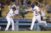 Los Angeles Dodgers' Will Smith, right, celebrates his two-run home run with third base coach Dino Ebel during the fourth inning of a baseball game against the Philadelphia Phillies in Los Angeles, Monday, June 14, 2021. (AP Photo/Kyusung Gong)