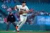 San Francisco Giants third baseman Jason Vosler throws to first base on a base hit by Arizona Diamondbacks' Eduardo Escobar during the first inning of a baseball game in San Francisco, Monday, June 14, 2021. (AP Photo/Jeff Chiu)