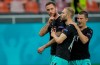 Austria's Marko Arnautovic, left, celebrates with teammates after scoring his side's third goal during the Euro 2020 soccer championship group C match between Austria and Northern Macedonia at the National Arena stadium in Bucharest, Romania, Sunday, June 13, 2021. (AP Photo/Vadim Ghirda, Pool)