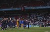 Finnish players celebrate with their fans after the Euro 2020 soccer championship group B match between Denmark and Finland at Parken stadium in Copenhagen, Denmark, Saturday, June 12, 2021. Finland won 1-0. (Friedemann Vogel/Pool via AP)