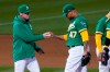 Oakland Athletics pitcher Frankie Montas (47) hands the ball to manager Bob Melvin as he is taken out for a relief pitcher during the seventh inning of a baseball game against the Kansas City Royals in Oakland, Calif., Thursday, June 10, 2021. (AP Photo/Jeff Chiu)
